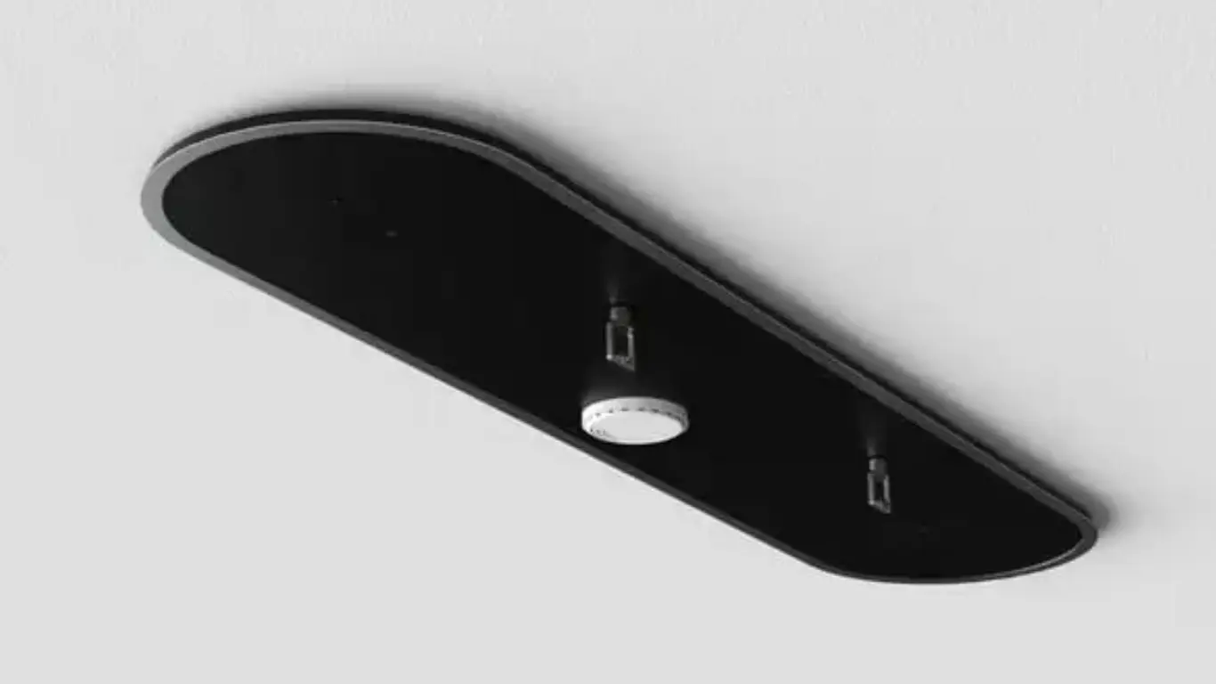 Ceiling-mounted modern fire suppression system with dual nozzles and a central detector on a sleek black panel.